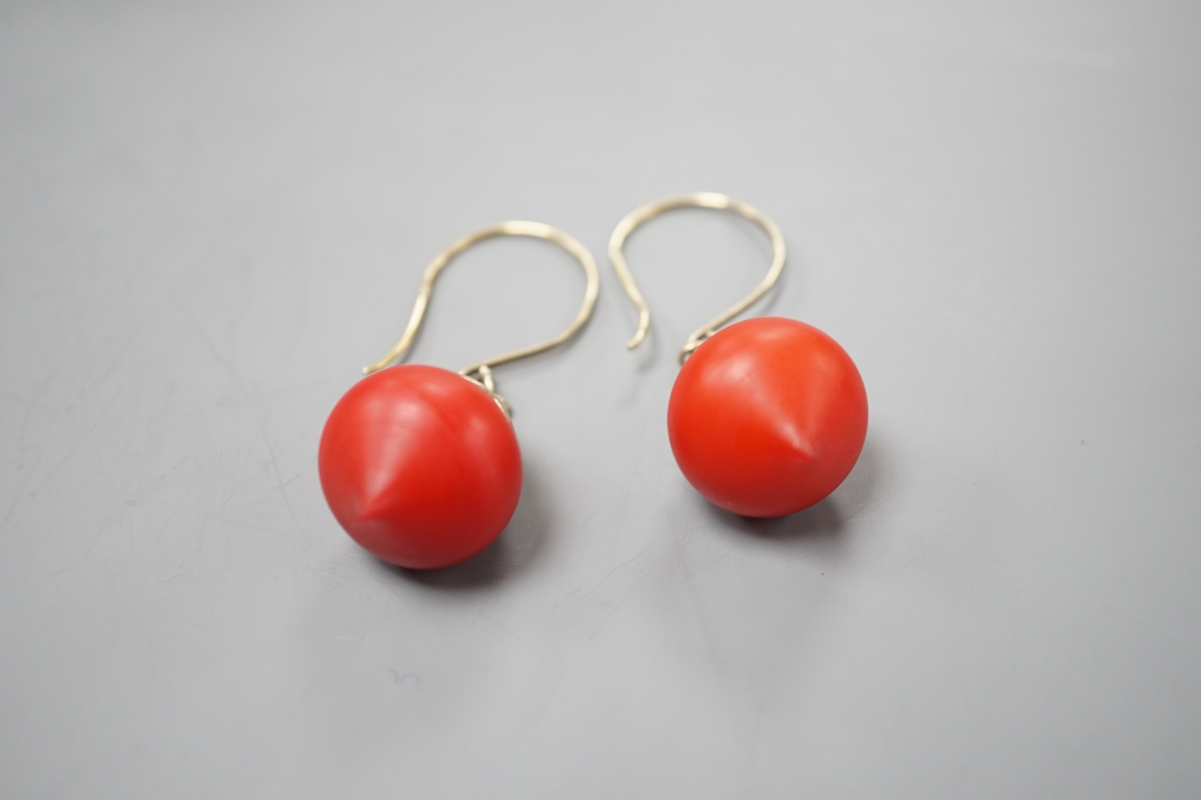 A pair of gilt white metal and stained wood drop earrings, 30mm.